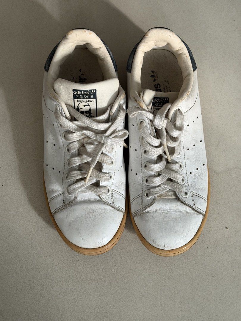 Adidas Stan Smith White Leather Sneakers (Category: Sneakers) located in Taguig. Submitted by anxmz (Listing ID 1463424909, Image 1). Description: - Classic Adidas Stan Smith sneakers - White leather with gum sole - Size 6.5 US Women's - Shows some signs of wear (as pictured) - Great for everyday wear.