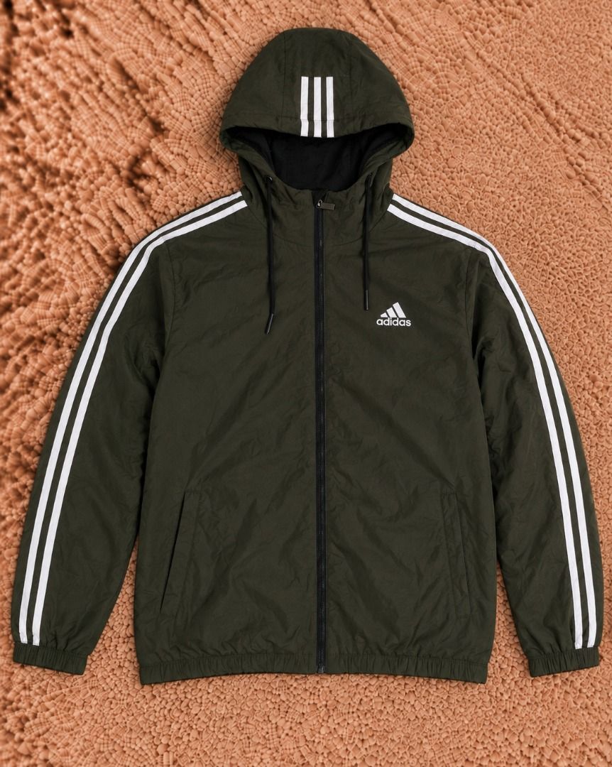 Adidas Track Jacket (Category: Coats, Jackets and Outerwear) located in Quezon City. Submitted by drift_and_vibe_thrift (Listing ID 1463511273, Image 1). Description: - Classic Adidas track jacket - Iconic three stripes on sleeves - Zip-up front with stand-up collar - Two side pockets - Ideal for casual wear or sports.