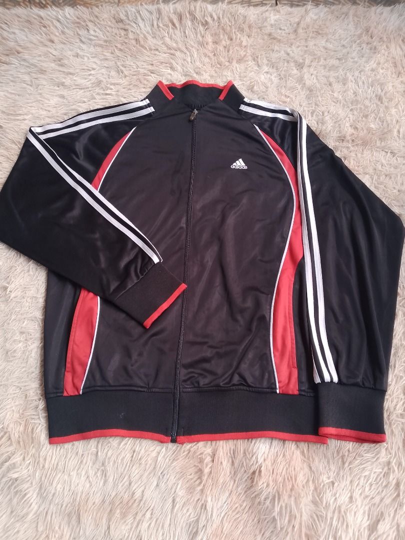 Adidas Track Jacket Black Red White Stripes (Category: Coats, Jackets and Outerwear) located in Caloocan City. Submitted by hoodiegeng (Listing ID 1463397580, Image 1). Description: - Classic Adidas track jacket - Color: Black with red and white accents - Iconic three stripes on sleeves - Full zip closure - Ribbed cuffs and hem - Ideal for casual wear or sports.