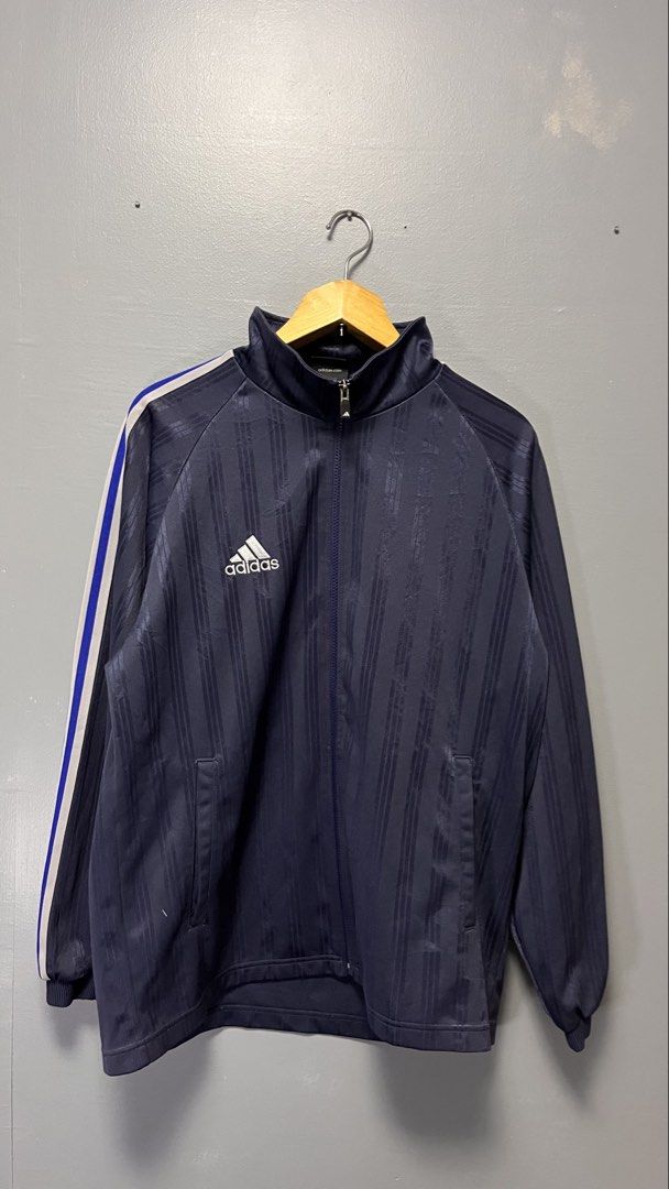 Adidas Track Jacket Navy Blue White Blue Stripes (Category: Coats, Jackets and Outerwear) located in Cabuyao City. Submitted by bulandos (Listing ID 1463436431, Image 1). Description: - Classic navy blue Adidas track jacket - White and blue stripes on sleeves - Iconic Adidas logo on front and large logo on back - Full zip closure - Made in China - Material: Polyester.