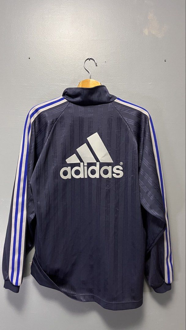 Adidas Track Jacket Navy Blue White Blue Stripes (Category: Coats, Jackets and Outerwear) located in Cabuyao City. Submitted by bulandos (Listing ID 1463436431, Image 2). Description: - Classic navy blue Adidas track jacket - White and blue stripes on sleeves - Iconic Adidas logo on front and large logo on back - Full zip closure - Made in China - Material: Polyester.