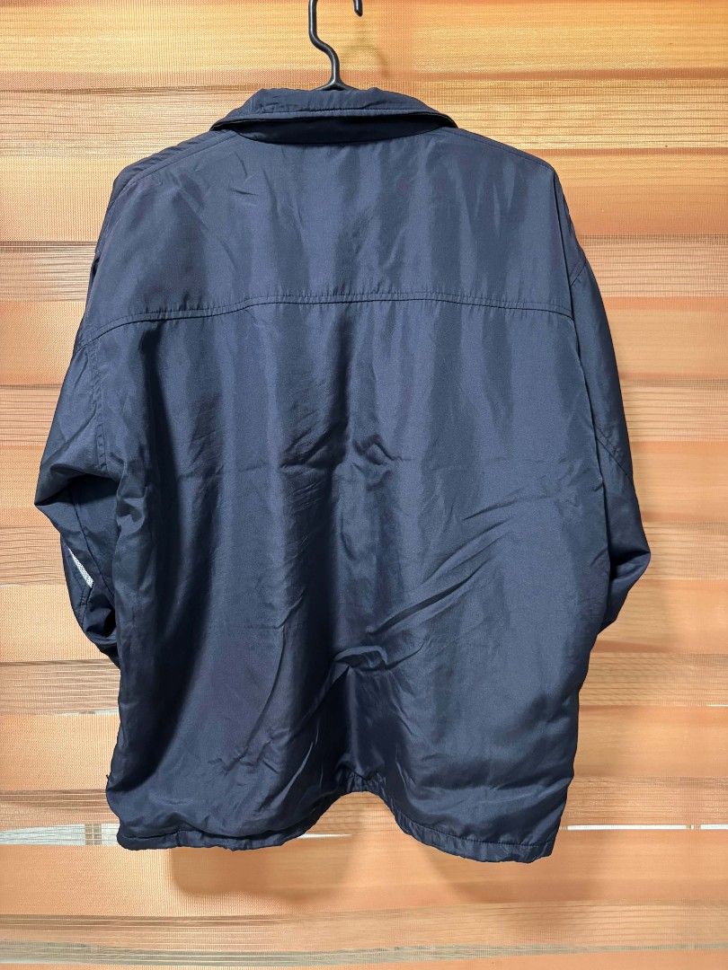 Adidas Windbreaker Jacket Navy Blue (Category: Coats, Jackets and Outerwear) located in Makati City. Submitted by rexb1993 (Listing ID 1463494549, Image 2). Description: - Classic navy blue Adidas windbreaker jacket - Iconic three stripes on sleeves - Lightweight and perfect for layering - Full zip closure - Two side pockets - Breathable mesh inner lining - Ideal for casual wear or sports.