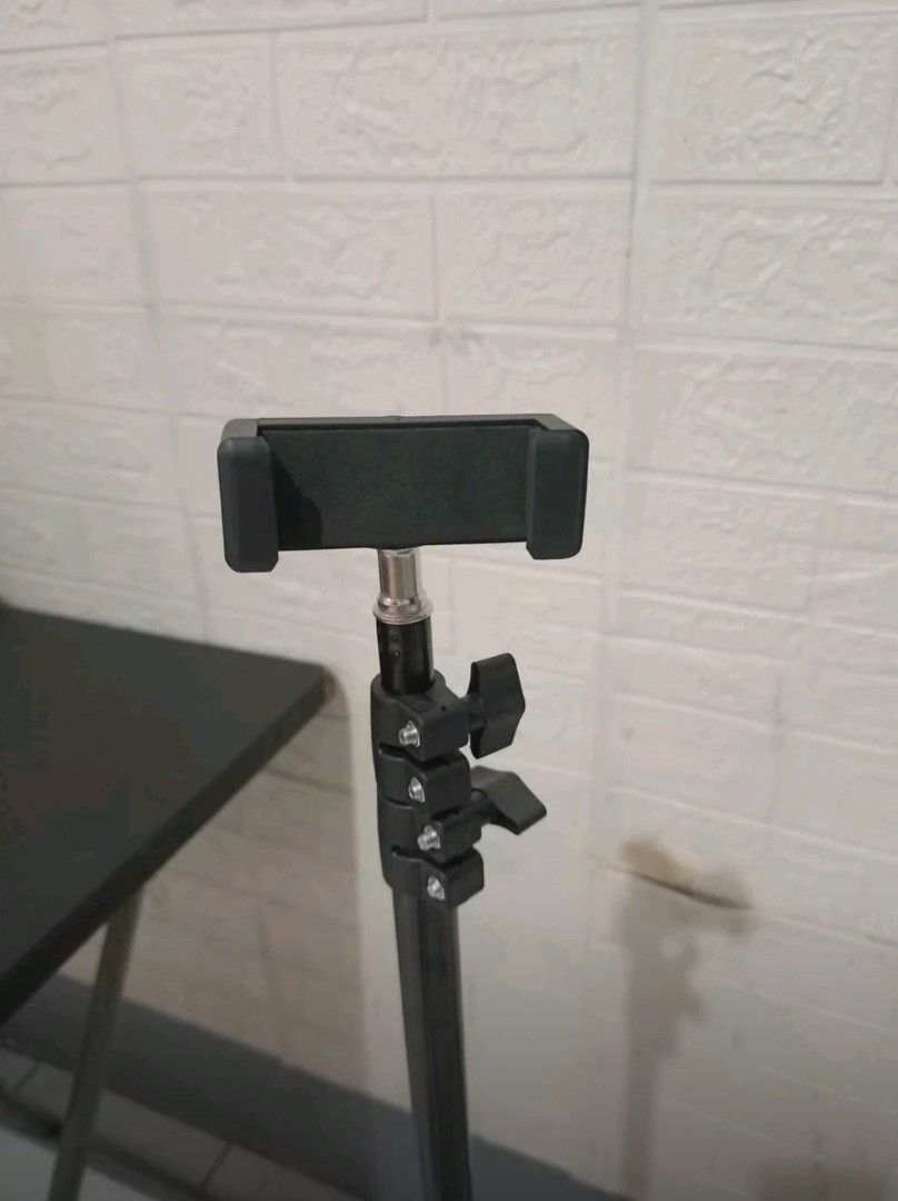 ADJUSTABLE PHONE & LIGHTTRIPOD STAND (Category: Tripods & Monopods) located in Pasig City. Submitted by jamillandingin (Listing ID 1463364393, Image 3). Description: ADJUSTABLE PHONE & LIGHT TRIPOD STAND-- ₱350 BINUKSAN LANG NEVER NAGAMIT DETAILS - Multi-purpose: Great for ring lights, phones, or lightweight cameras - Adjustable height with secure quick-flip locks. - Sturdy three-legged tripod base Perfect for live sellers, vloggers, content crea