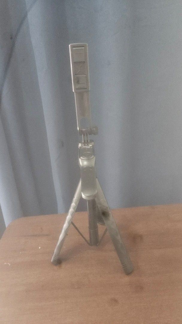 Adjustable Tripod Stand for Camera or Phone (Category: Tripods & Monopods) located in Manila. Submitted by jessielevi777 (Listing ID 1463551795, Image 2). Description: - Versatile tripod for cameras and smartphones - Adjustable height for perfect framing - Sturdy and stable legs ensure secure placement - Folds compactly for easy storage and transport - Ideal for photography and video recording.