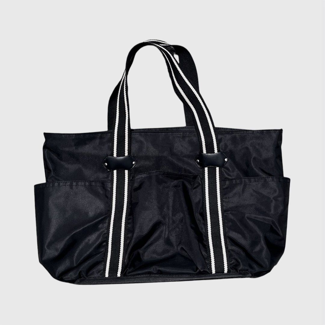 Agnes B Voyage Tote Bag (Category: Tote Bags) located in Calamba. Submitted by juan_jawnz (Listing ID 1463396273, Image 2). Description: Agnes B. Voyage Multi-Pocket Nylon Tote Bag PHP 880 Length - 12 Inches Width - 19 Inches Black nylon / satin finish, signature striped webbing handles with leather tab, front 3-pocket system + agnès b. logo patch. Lightweight but holds a lot — work, school, travel. LL Bean Tote bag .