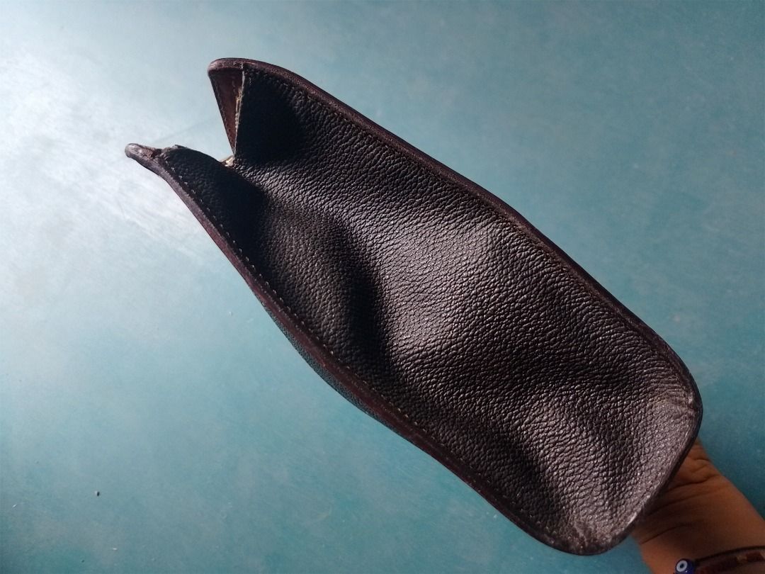 Aigner Black Monogram Leather Pouch Clutch (Category: Luxury Bags & Wallets) located in Caloocan City. Submitted by hmm_shop83 (Listing ID 1463390713, Image 3). Description: - Vintage Aigner pouch - Black monogram leather with brown trim - Zipper closure - Perfect for organizing essentials or as a small clutch.