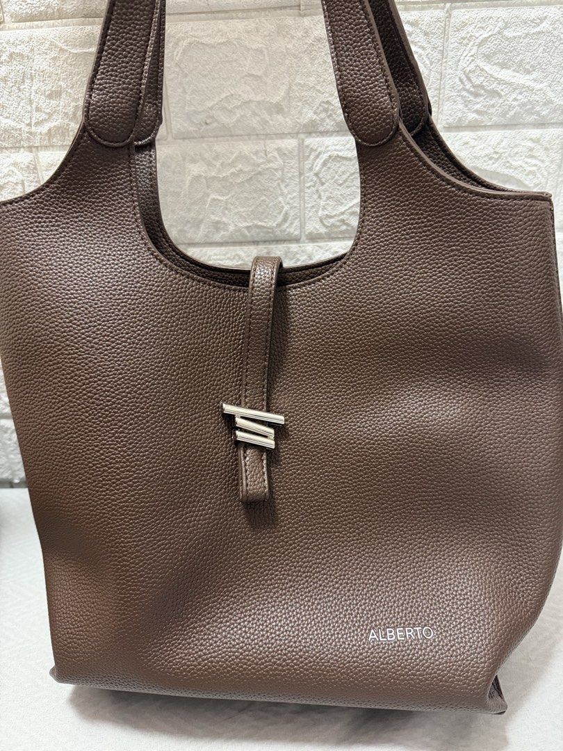ALBERTO BAG (Category: Shoulder Bags) located in Manila. Submitted by fayerdl (Listing ID 1463391338, Image 2). Description: LIGHTLY USED ALBERTO LIV BAG Perfect work/school bag! Has a minor flaw at the bottom but not noticeable. Has a detachable pouch! 🤍 Drop strap: 34cm Height: 25cm Width: 11cm Length: 32.5cm Loc: Tondo, manila.