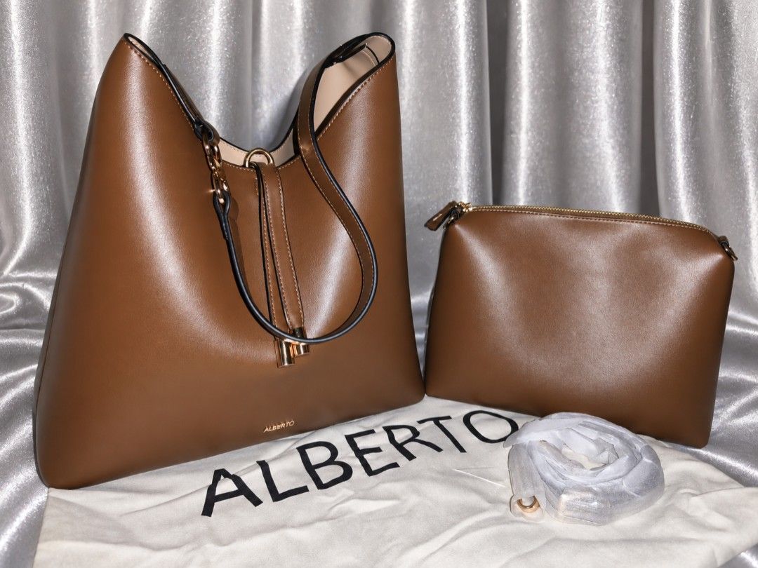 Alberto Cazipia Maxi handbag (Category: Shoulder Bags) located in Manila. Submitted by chunlimuffin_0408 (Listing ID 1460591787, Image 2). Description: FOR SALE Alberto Cazipia 2 in 1 Maxi bag Repriced: Php2200 Used once Rfs: too big for me, I don't carry a lot of things With dustbag. Bought last September 8. No paper bag. Bought for Php2799 📍Guadalupe Nuevo Makati City.
