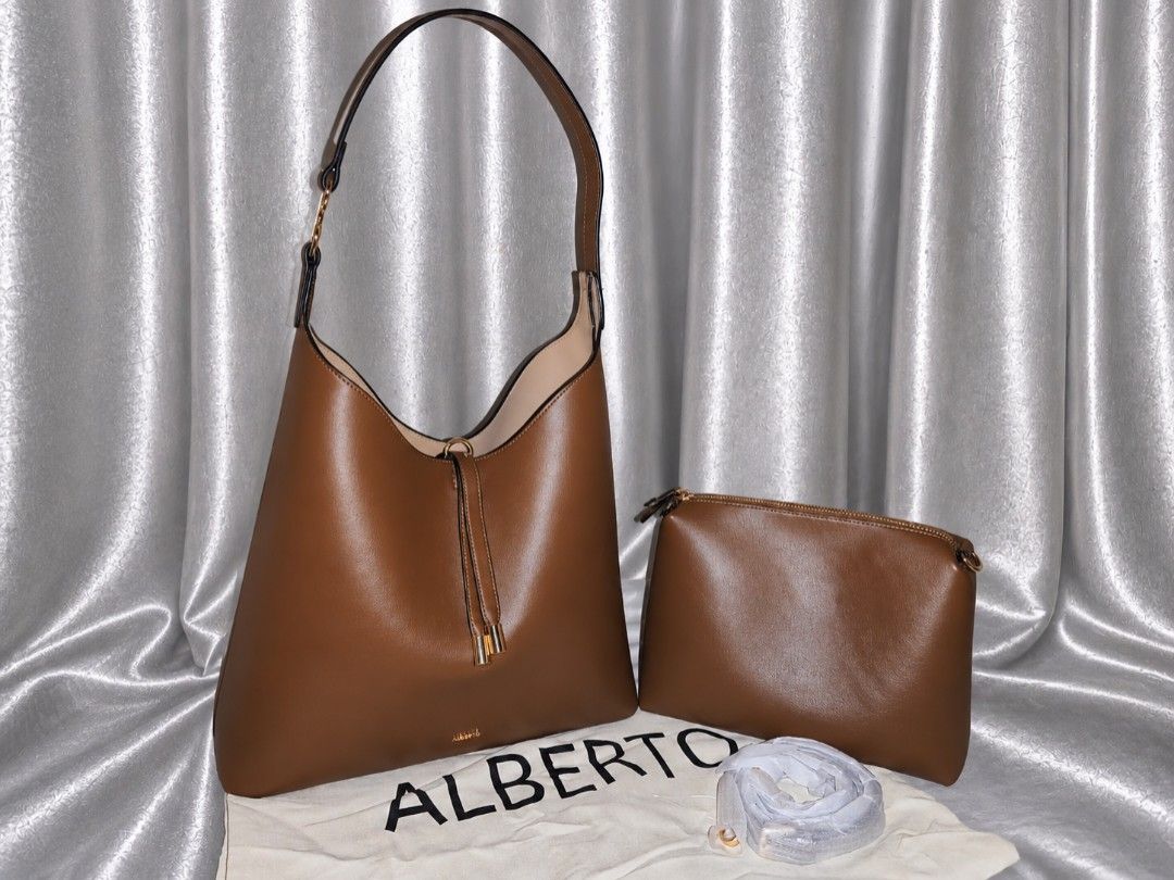 Alberto Cazipia Maxi handbag (Category: Shoulder Bags) located in Manila. Submitted by chunlimuffin_0408 (Listing ID 1460591787, Image 1). Description: FOR SALE Alberto Cazipia 2 in 1 Maxi bag Repriced: Php2200 Used once Rfs: too big for me, I don't carry a lot of things With dustbag. Bought last September 8. No paper bag. Bought for Php2799 📍Guadalupe Nuevo Makati City.