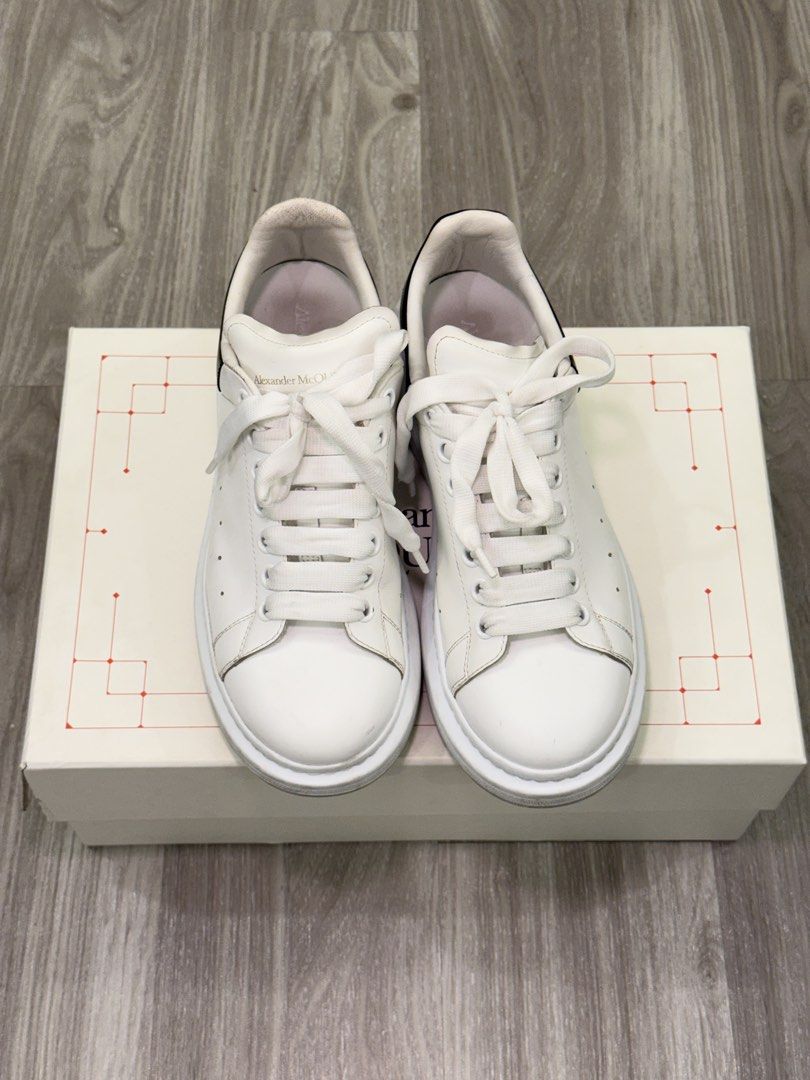 Alexander McQueen Oversized Sneakers White Black (Category: Casual Shoes) located in Manila. Submitted by silent_dosss (Listing ID 1463379053, Image 3). Description: - Authentic Alexander McQueen Oversized Sneakers - Color: White leather with a black heel tab - Iconic chunky sole design - Comes with the original box - Ideal for stylish everyday wear.