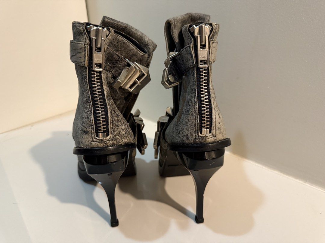 Alexander Wang Grey Buckled Heeled Boots Size 39 (Category: Boots) located in Manila. Submitted by bellarhianna777 (Listing ID 1463333249, Image 3). Description: - Grey Alexander Wang heeled boots - Size 39 - Multiple silver buckles and back zippers - Chunky platform sole with stiletto heel - Unique distressed leather look - Perfect statement piece for any outfit.