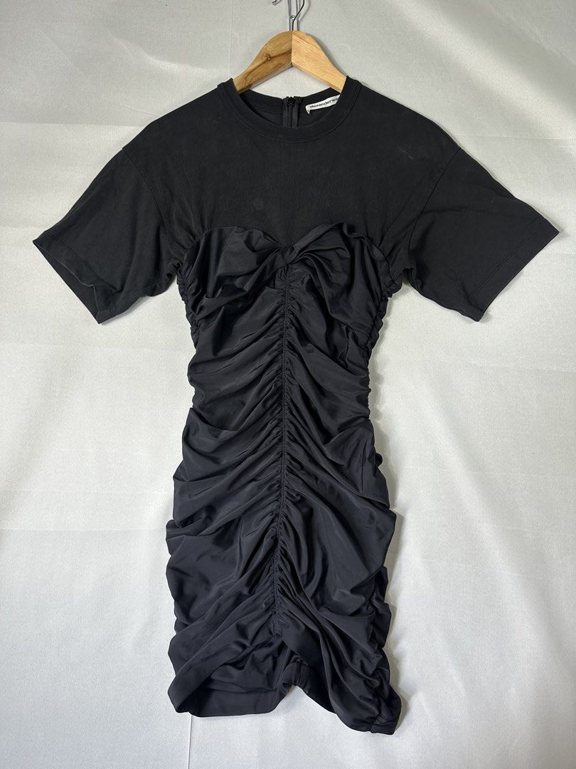 Alexanderwang Black Slim Ruflled Dress (Category: Dresses) located in Cabanglasan. Submitted by thefashiongarage.co (Listing ID 1463399887, Image 2). Description: Title - Alexanderwang Model/Name - Size on Tag - Small Conditiion - Excellent Condition with 1 Punhole Dimension (WxLxH) - 35 inches Length Category- Mini Dress Fitting - Slim Fit Made in - china Material - Cotton/Polyamide/ Elastine Color - Black Design - Year - Inclusion - None Note -