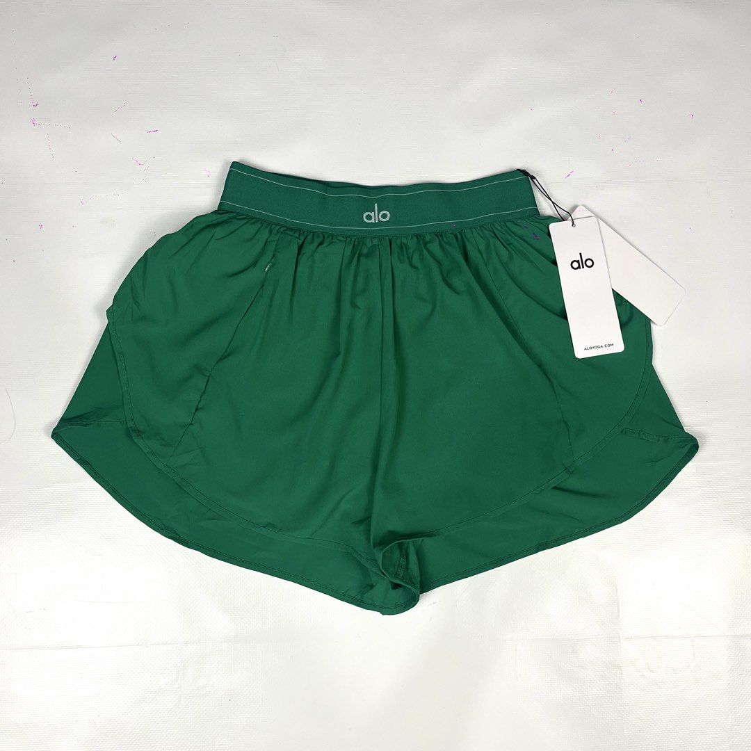 Alo Yoga Green Match Point (Category: Activewear) located in Manila. Submitted by strict_wear (Listing ID 1463336115, Image 1). Description: - Brand: Alo Yoga - Color: Green - Size: S (24-28 Waistline Can Fit) - Features: Elastic waistband with drawstring, zippered side pocket - Condition: Brand new with tags attached - Ideal for: Running, workouts,pickleball.