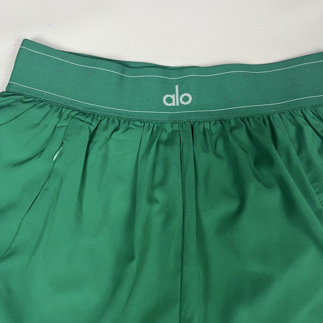 Alo Yoga Green Match Point (Category: Activewear) located in Manila. Submitted by strict_wear (Listing ID 1463336115, Image 3). Description: - Brand: Alo Yoga - Color: Green - Size: S (24-28 Waistline Can Fit) - Features: Elastic waistband with drawstring, zippered side pocket - Condition: Brand new with tags attached - Ideal for: Running, workouts,pickleball.