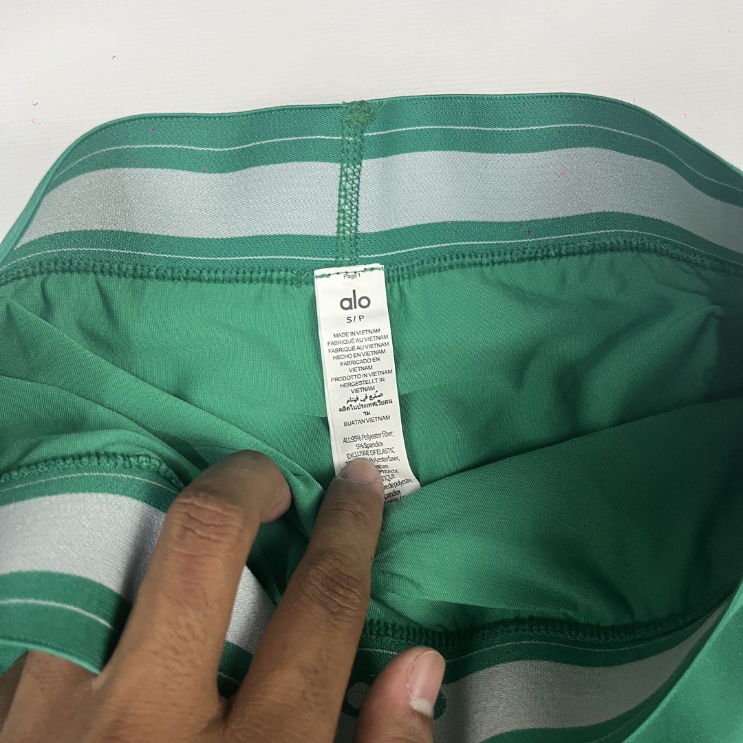Alo Yoga Green Match Point (Category: Activewear) located in Manila. Submitted by strict_wear (Listing ID 1463336115, Image 2). Description: - Brand: Alo Yoga - Color: Green - Size: S (24-28 Waistline Can Fit) - Features: Elastic waistband with drawstring, zippered side pocket - Condition: Brand new with tags attached - Ideal for: Running, workouts,pickleball.