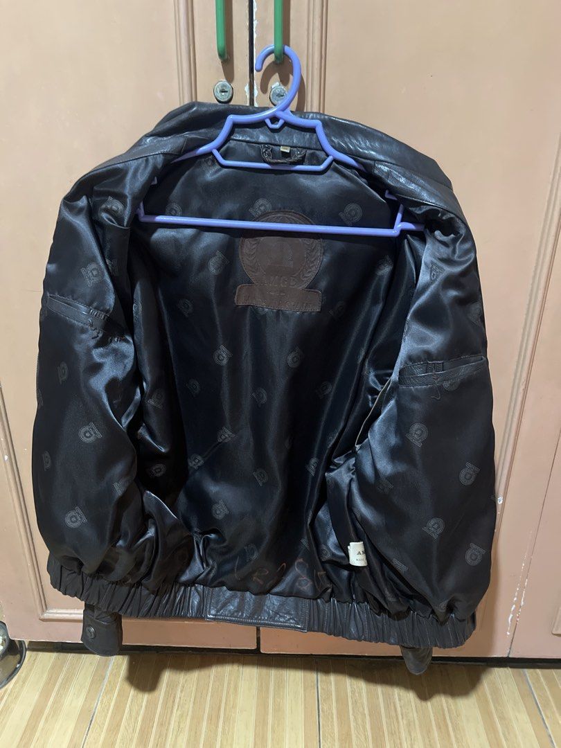AMGE Genuine Leather Jacket Made in Spain (Category: Coats, Jackets and Outerwear) located in Quezon City. Submitted by donnabelle7572 (Listing ID 1463436270, Image 3). Description: -Last Price - Classic dark brown leather jacket - Brand: AMGE - Made in Spain - Smooth satin lining with subtle branding - Elasticated cuffs and hem - Two front pockets - Ideal for cooler weather - Timeless wardrobe staple.