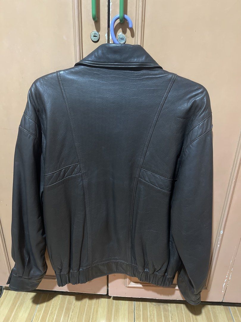 AMGE Genuine Leather Jacket Made in Spain (Category: Coats, Jackets and Outerwear) located in Quezon City. Submitted by donnabelle7572 (Listing ID 1463436270, Image 2). Description: -Last Price - Classic dark brown leather jacket - Brand: AMGE - Made in Spain - Smooth satin lining with subtle branding - Elasticated cuffs and hem - Two front pockets - Ideal for cooler weather - Timeless wardrobe staple.