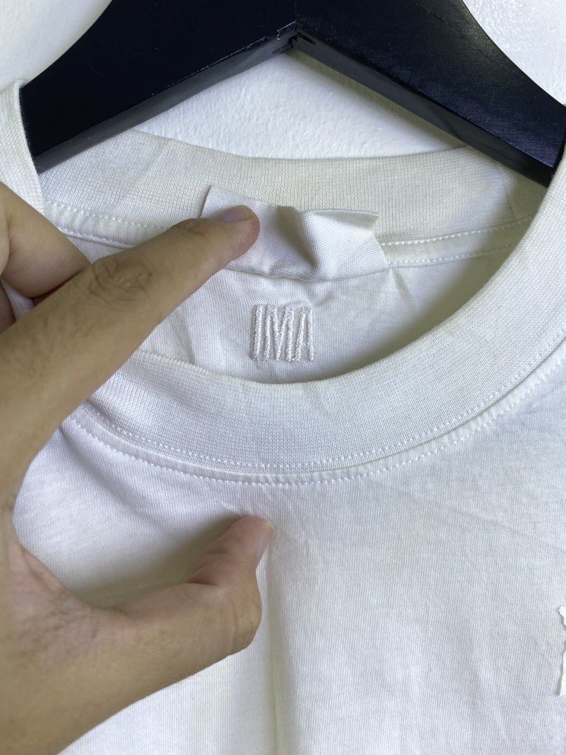 Ami Paris Tee (Category: Tshirts & Polo Shirts ) located in Manila. Submitted by declutterpromax (Listing ID 1463402679, Image 3). Description: Yellowing all around the item.