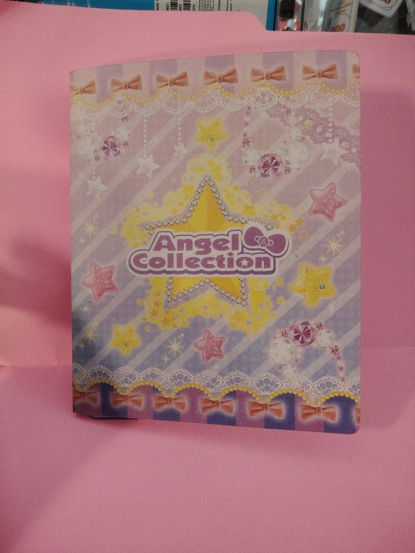 Angel Collection Trading Cards Binder (Category: Raw Singles) located in Baguio. Submitted by ezelmix94436 (Listing ID 1463484792, Image 3). Description: - Angel Collection trading cards - Japanese cards, likely from an arcade game - Features cute outfits and accessories - Binder included - Perfect for collectors or fans of Japanese card games.
