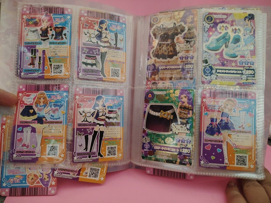 Angel Collection Trading Cards Binder (Category: Raw Singles) located in Baguio. Submitted by ezelmix94436 (Listing ID 1463484792, Image 2). Description: - Angel Collection trading cards - Japanese cards, likely from an arcade game - Features cute outfits and accessories - Binder included - Perfect for collectors or fans of Japanese card games.