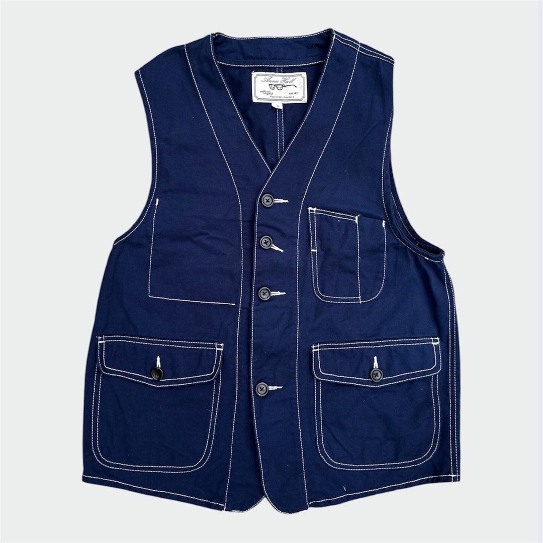 Annie Hall Vest (Category: Vests) located in Calamba. Submitted by juan_jawnz (Listing ID 1463395989, Image 1). Description: Annie Hall Vest PHP 780 Length- 24.25 Inches Width - 18 Inches Navy cotton with white contrast stitching. V-neck 4-button front, 4-pocket configuration (2 chest, 2 lower flap with buttons). Back vent detail. Heavy cotton, boxy fit. Amekaji Orgueil workwear .
