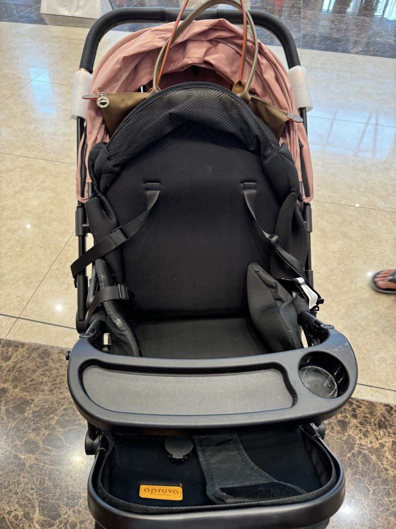 Aprica Stroller - Pink and Black (Category: Strollers) located in Manila. Submitted by brightfire-e610 (Listing ID 1463342514, Image 2). Description: - Lightweight stroller in pink and black - Removable tray with cup holder - Secure 5-point harness - Sun-protective canopy - Easy to fold and carry - Ideal for daily use and travel.