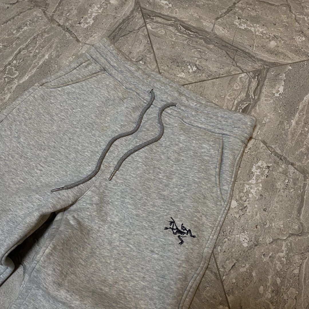 Arc'teryx Grey Logo Sweatpants Size M (Category: Joggers) located in Manila. Submitted by _vnnnsss (Listing ID 1463488387, Image 2). Description: - Brand: Arc'teryx - Color: Grey - Size: Medium - Features: Brand logo on left leg, elastic waistband with drawstring, ribbed cuffs - Style: Comfortable, casual - Ideal for: Lounging, everyday wear.