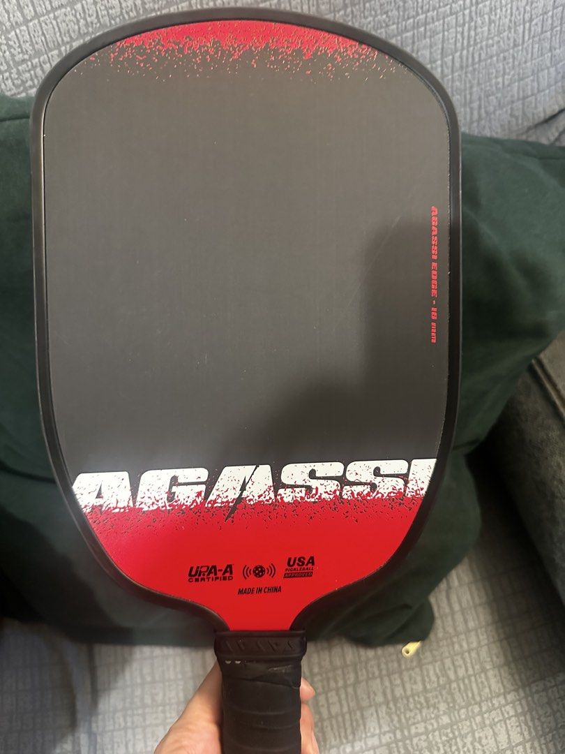 Auth Joola Agassi Edge 16mm (Category: Racket and Ball Sports) located in Mandaluyong City. Submitted by hdvvv (Listing ID 1463446443, Image 1). Description: Model: JOOLA Agassi Edge 16mm * Series: Agassi x JOOLA * Core: 16 mm * Weight: ~7.8 oz * Length: 16.5” * Width: 7.5” * Grip: 4.25”, 5.5” long * Surface: Carbon Friction Surface * Shape: Elongated * UPA-A certified Rfs: Upgrade.
