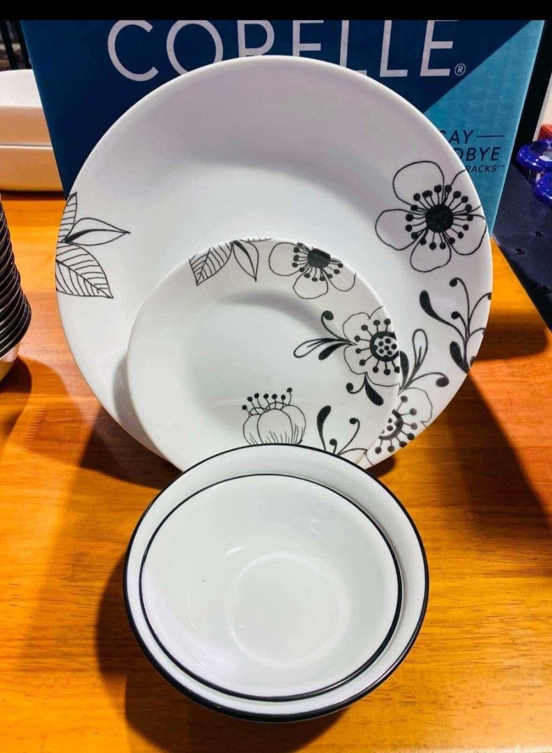 Authentic Corelle 16-pc Inked Poppy Dinnerware. Made in USA (Category: Dinnerware & Cutlery) located in Paranaque City. Submitted by sarisariph8 (Listing ID 1463545907, Image 1). Description: POPPY DESIGN CORELLE ￼ Bohemian and dramatic, this black and white pattern is a bold statement for your table. Inked Poppy is very modern, but with a hint of floral tradition, it’s at home anywhere. Pair it with colorful serving pieces to emphasize the drama