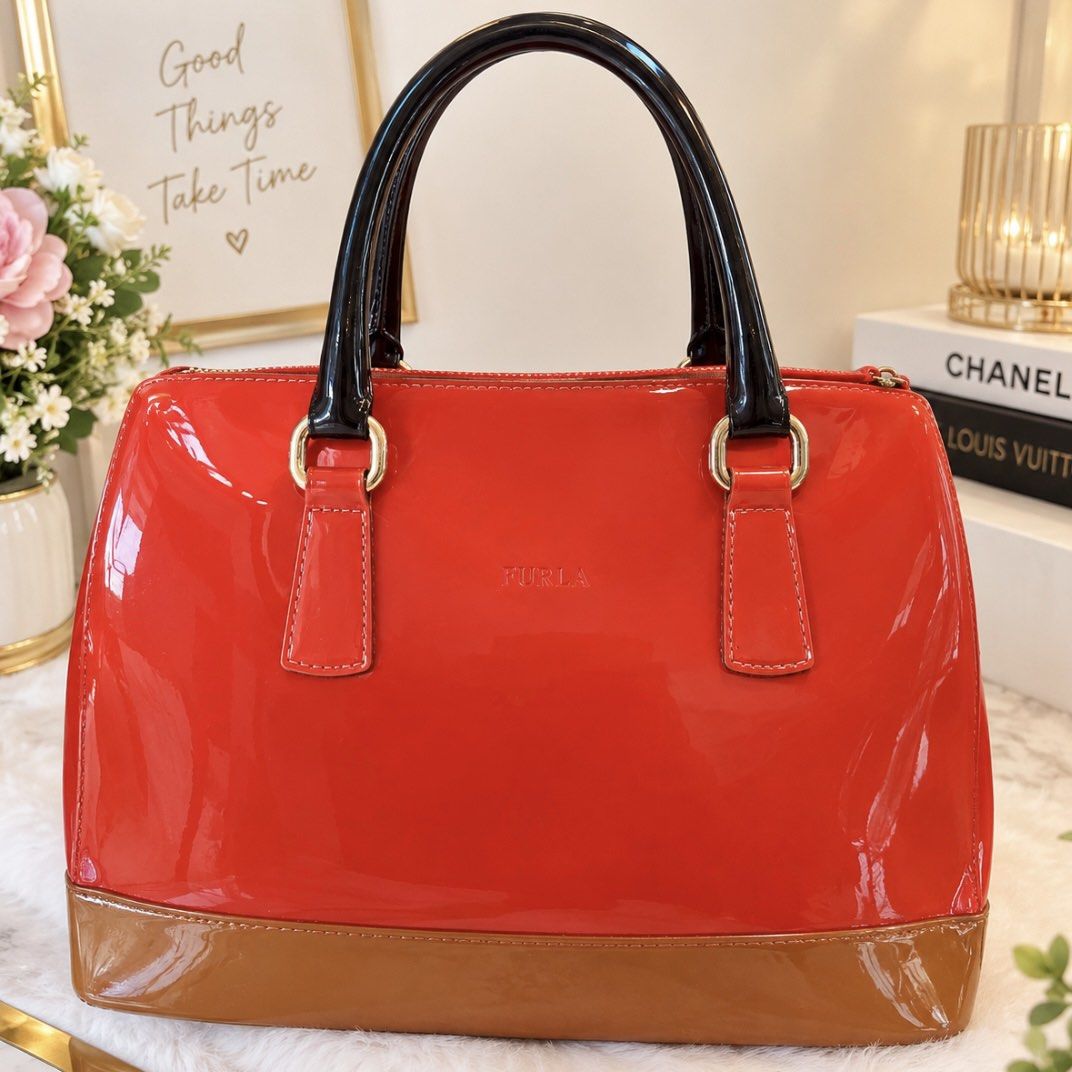 Authentic Furla Red Patent Leather Top Handle Bag (Category: Luxury Bags & Wallets) located in Paranaque City. Submitted by juanstopshop23 (Listing ID 1463368966, Image 1). Description: Bought this inside Singapore changi Airport Bright red patent leather Furla bag with black handles and tan base. Gold hardware. Classic shape, perfect for adding color to any outfit. Great for daily use or special occasions..