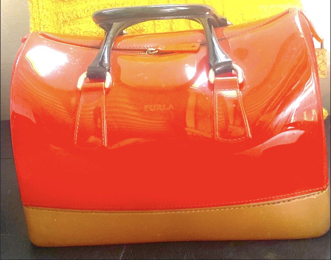 Authentic Furla Red Patent Leather Top Handle Bag (Category: Luxury Bags & Wallets) located in Paranaque City. Submitted by juanstopshop23 (Listing ID 1463368966, Image 3). Description: Bought this inside Singapore changi Airport Bright red patent leather Furla bag with black handles and tan base. Gold hardware. Classic shape, perfect for adding color to any outfit. Great for daily use or special occasions..