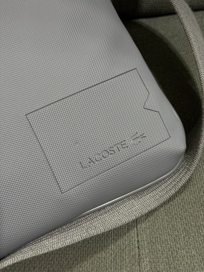 Authentic Lacoste Flat Crossbody (Category: Cross-body Bags) located in Quezon City. Submitted by chic.bags (Listing ID 1463493922, Image 2). Description: With etiketa Like new No issue Actual photo posted Mop: gcash.