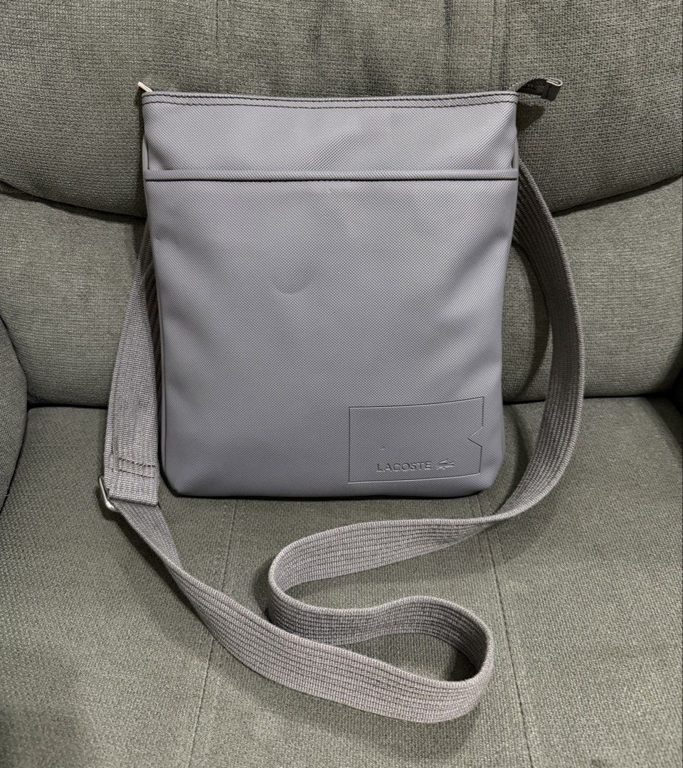Authentic Lacoste Flat Crossbody (Category: Cross-body Bags) located in Quezon City. Submitted by chic.bags (Listing ID 1463493922, Image 1). Description: With etiketa Like new No issue Actual photo posted Mop: gcash.