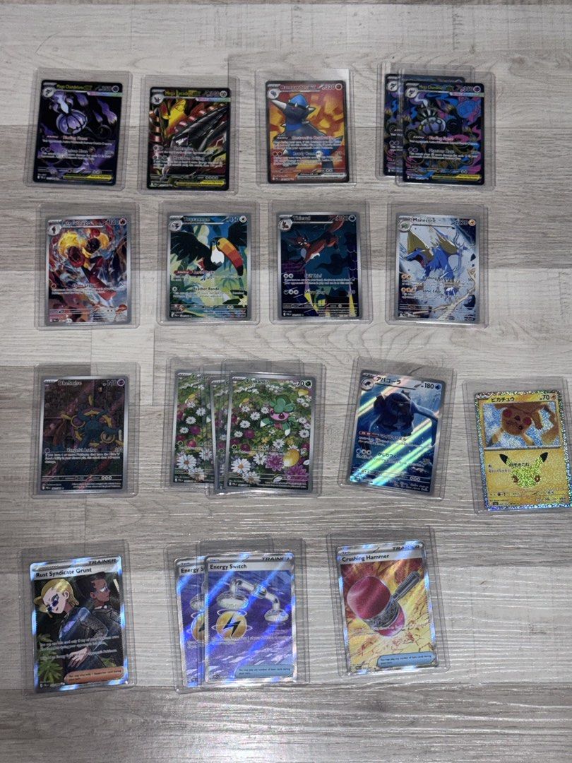 Authentic Pokemon TCG (Trading Cards) Mini Collection *TAKE ALL* (Category: Raw Singles) located in Mandaluyong City. Submitted by Angelo154 (Listing ID 1463457691, Image 2). Description: - Personal Pokemon Card Collection (English and Japanese Cards) - 1UP! Card Binder: Orange Toploader Binder (4-slot) - Sleeves - Additional 100+ Regular Pokemon Cards mostly from (Pitch Black), and a few from (Chaos Rising, Black Bolt, 30th Celebration) *Negotia