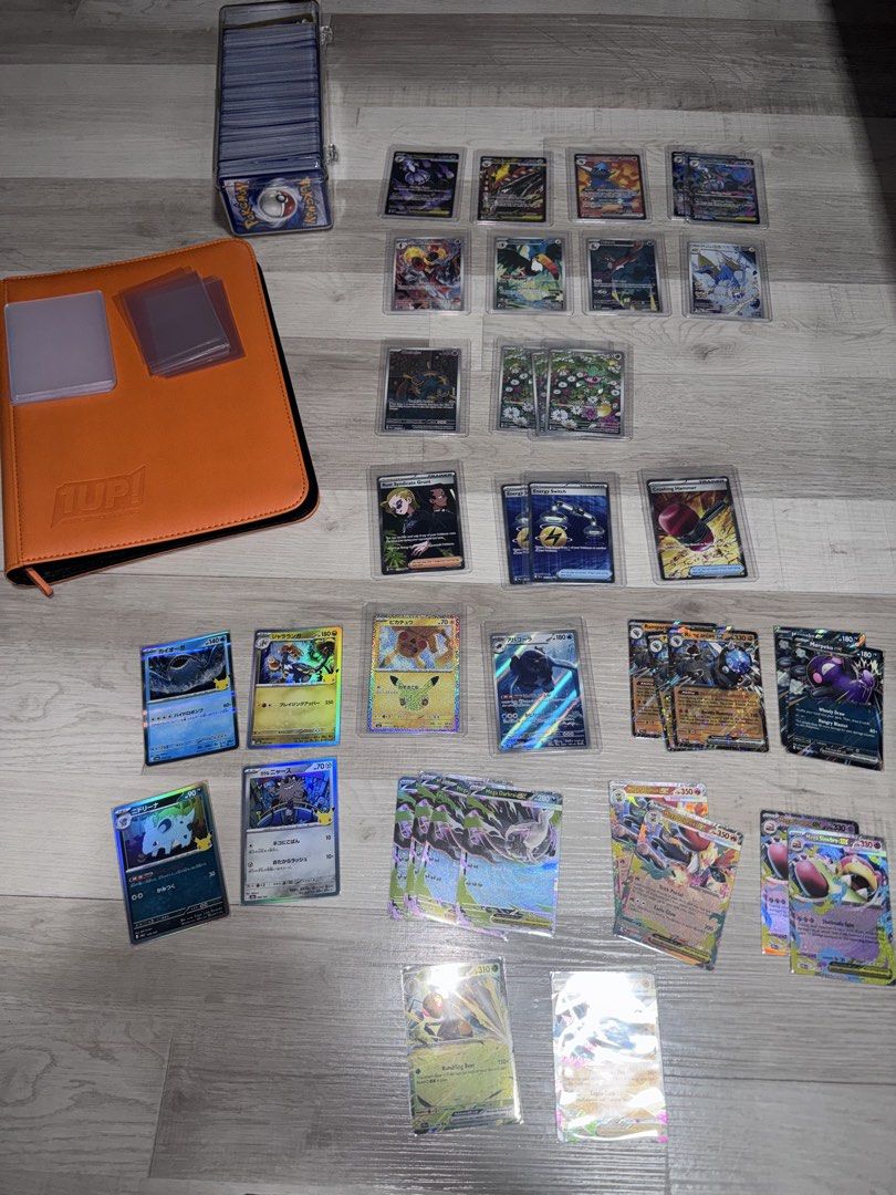 Authentic Pokemon TCG (Trading Cards) Mini Collection *TAKE ALL* (Category: Raw Singles) located in Mandaluyong City. Submitted by Angelo154 (Listing ID 1463457691, Image 1). Description: - Personal Pokemon Card Collection (English and Japanese Cards) - 1UP! Card Binder: Orange Toploader Binder (4-slot) - Sleeves - Additional 100+ Regular Pokemon Cards mostly from (Pitch Black), and a few from (Chaos Rising, Black Bolt, 30th Celebration) *Negotia