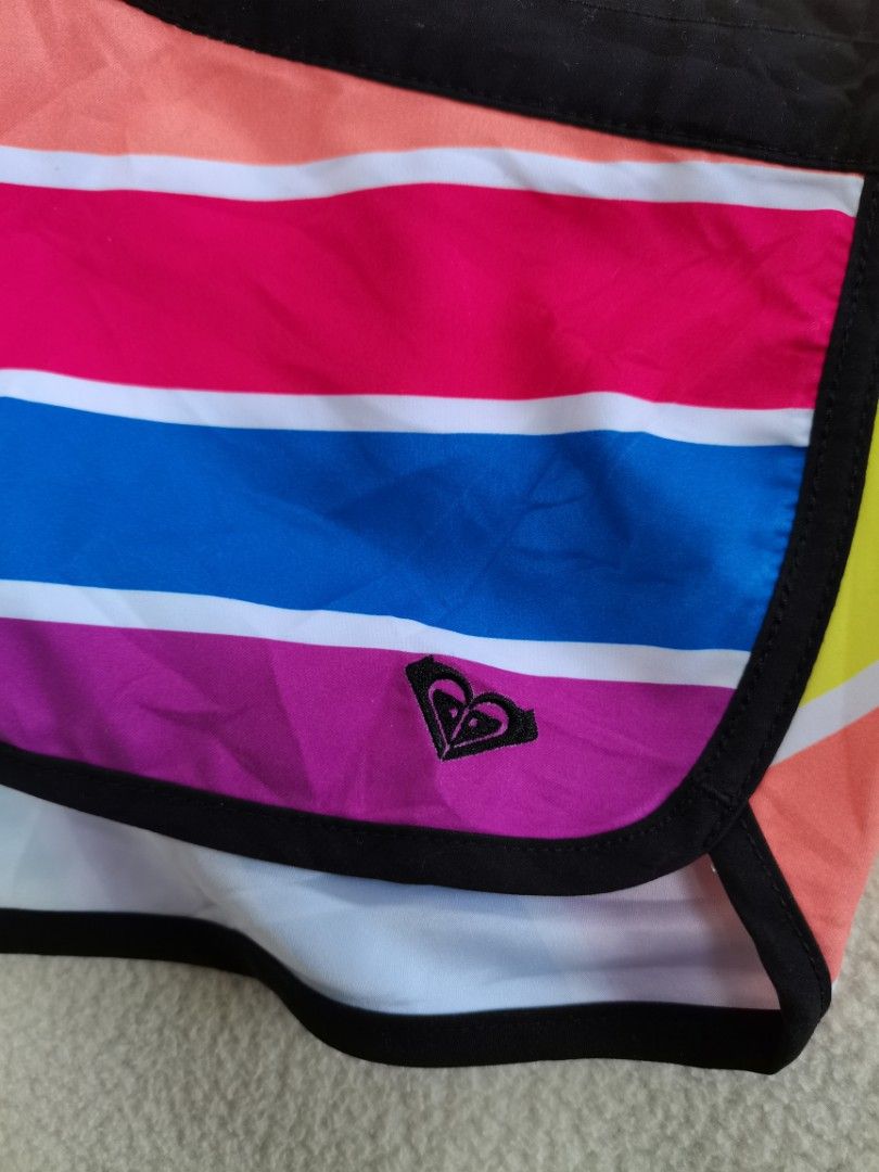 Authentic Roxy Rainbow Striped Boardshorts Swim Shorts (Category: Shorts) located in Santa Cruz. Submitted by oddpenguin-4575 (Listing ID 1463499141, Image 3). Description: 📌measurement:Laid flat Waist-16"/Rise-8"/Leg opening-12"/Hips-18.5" 📌size:AU 10 / US 6 (Fits like a local Women's Medium) 📌Brand:Roxy 📌color-10/10 📌-vibrant pair of Roxy boardshorts perfect for beach days, surfing, swimming, or casual summer wear. Features a striking colo