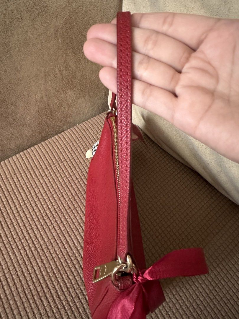 Authentic Vintage Coach Mini Shoulder Bag🍒 (Category: Luxury Bags & Wallets) located in Manila. Submitted by happyocean22 (Listing ID 1463463179, Image 3). Description: - Stylish red mini shoulder bag - Durable leather material - Spacious interior - Classic and versatile design.