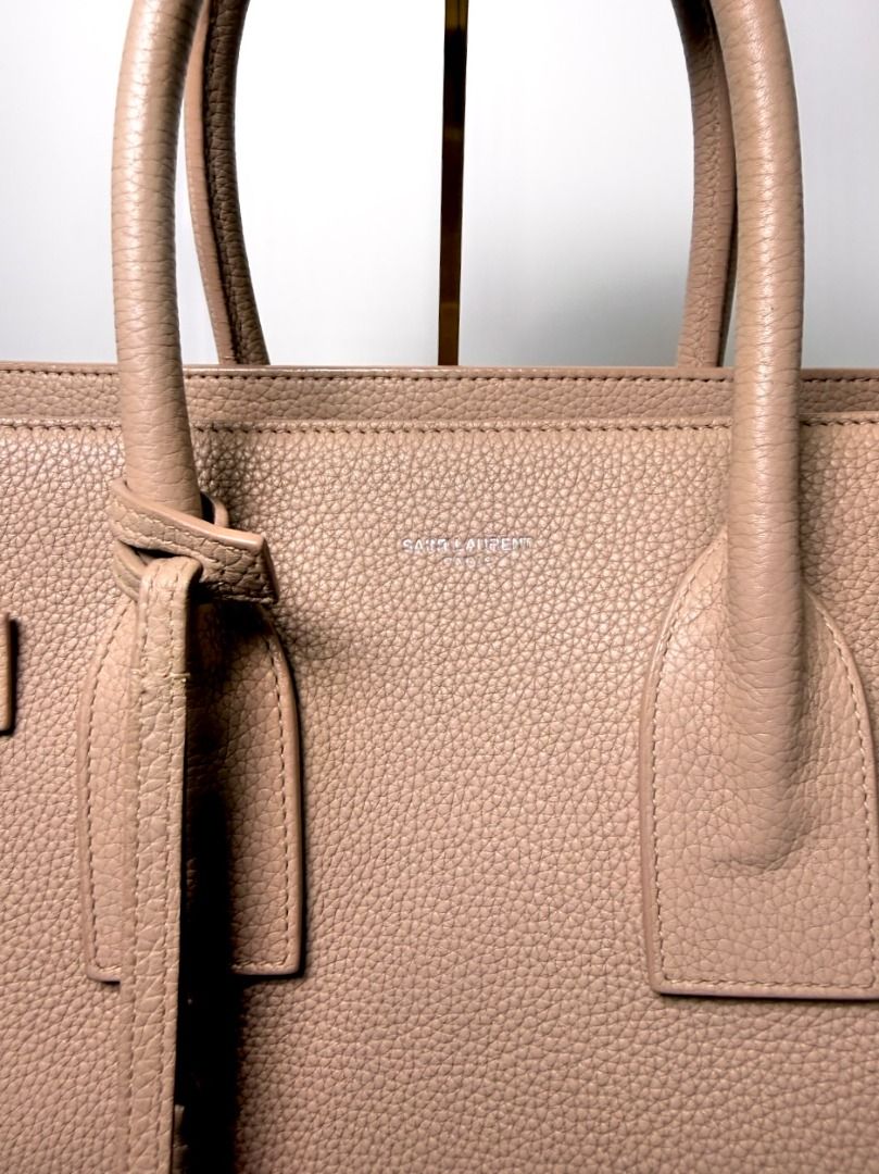 [AUTHENTIC] YSL Sac de Jour - Cream (Category: Luxury Bags & Wallets) located in Caloocan City. Submitted by luxegenieph (Listing ID 1463480476, Image 2). Description: For office girlies who want to put all their essentials in one bag. It gives girl-boss vibes. Ranking: AB Inclusions: Authenticity card, Certificate of Authenticity Assessment: Slight discoloration, signs of use 🏷️ ₱22,500 - Luxe Genie PH is not affiliated with any brands posted o