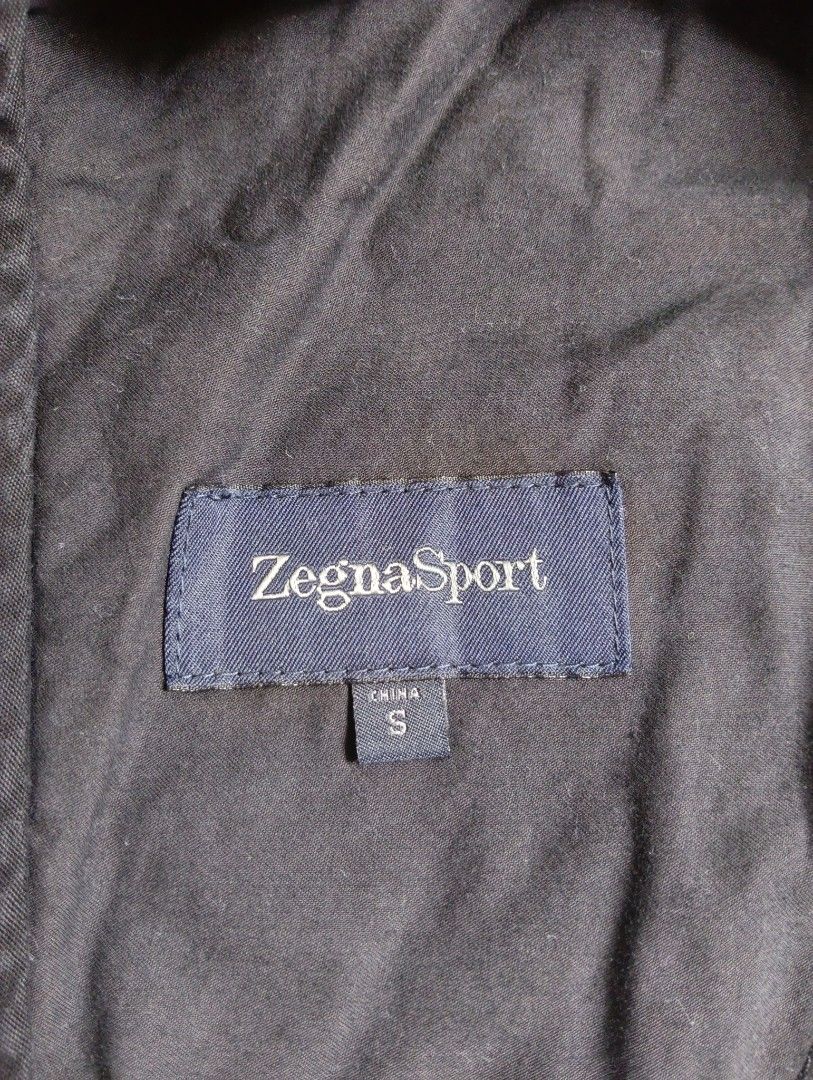Authentic Zegna Sport jacket ✅ (Category: Luxury Apparel) located in Cagayan de Oro. Submitted by warmbird-f84aab (Listing ID 1463453695, Image 2). Description: Brand: Zegna Sport (Ermenegildo Zegna) Size: S | Fits Small – Medium Color: Dark Charcoal / Black Material: Premium technical cotton blend — lightweight, breathable, sleek finish Origin: Made in China (standard for Zegna Sport line) ✅ 100% LEGIT — Verified Authentic - Official Zegna Sport