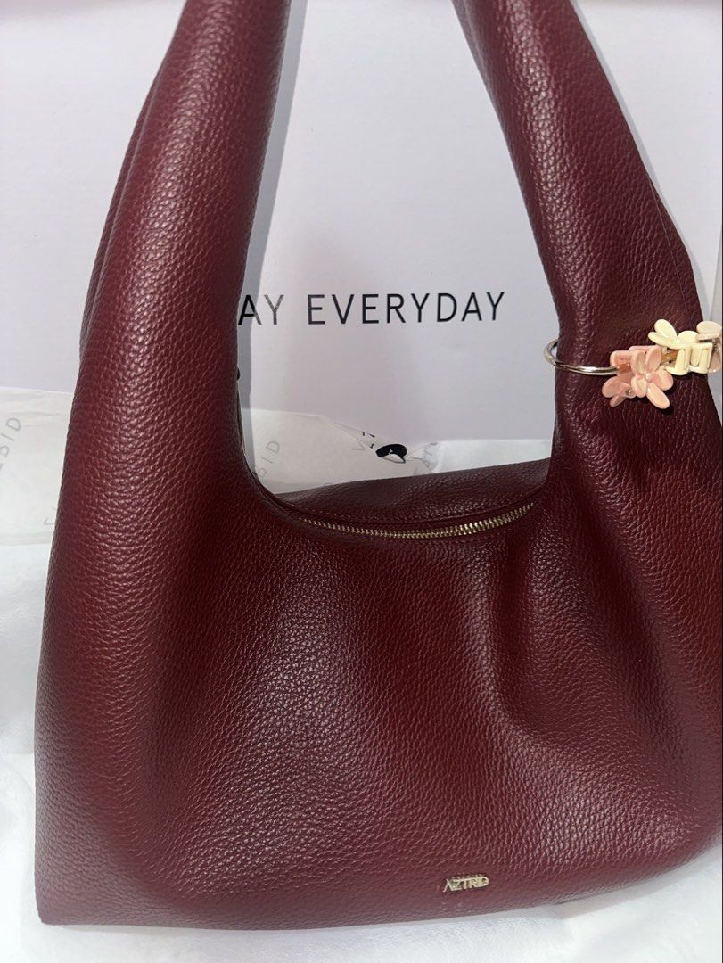 Aztrid Hobo Bag (Category: Shoulder Bags) located in Mandaluyong City. Submitted by prelovedmorawako (Listing ID 1463553075, Image 3). Description: 📌Helping a friend. ✅ used but not abused ✅ Medium size ✅ Redox color ✅ dust bag and box included.