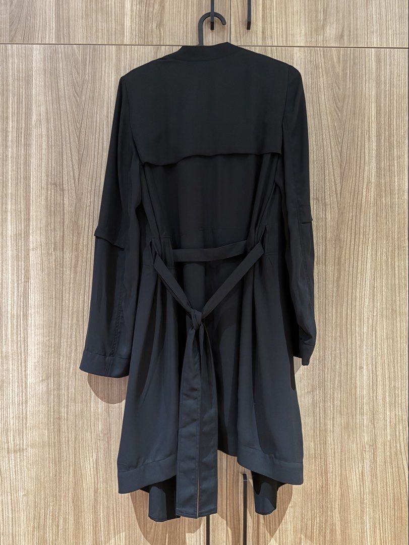 ARITZIA Babaton Black Draped Open Front Belted Jacket XS (Category: Coats, Jackets and Outerwear) located in Manila. Submitted by twister4 (Listing ID 1463501993, Image 2). Description: - Brand: ARITZIA Babaton - Style: Black draped jacket - Features: Open front, tie belt at back, long sleeves with layered detail - Material: 100% polyester - Origin: Made in China - Perfect for: Layering over outfits.