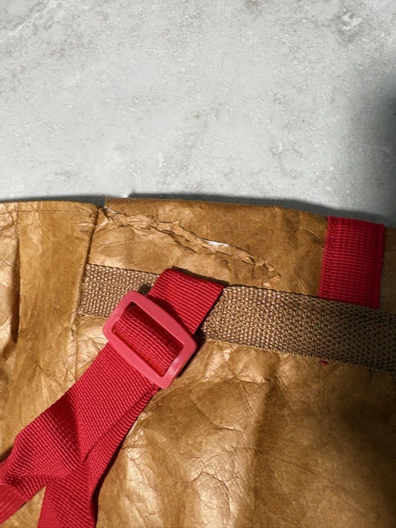 Backpack (Category: Shoulder Bags) located in Singapore. Submitted by jodiestrawberry (Listing ID 1463335484, Image 5). Description: There is a tear on the opening and had been repaired see last two pictures. It's not really paper bag, it’s like waterproof and the material is stronger than the normal paper.