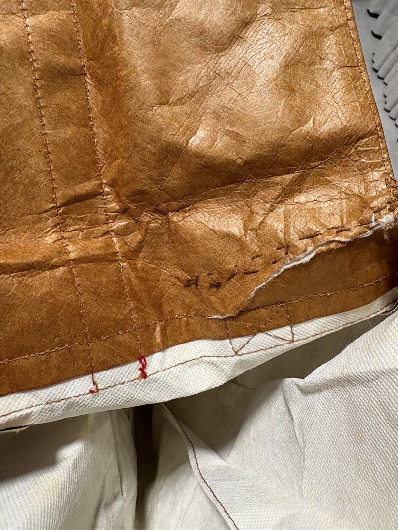 Backpack (Category: Shoulder Bags) located in Singapore. Submitted by jodiestrawberry (Listing ID 1463335484, Image 6). Description: There is a tear on the opening and had been repaired see last two pictures. It's not really paper bag, it’s like waterproof and the material is stronger than the normal paper.