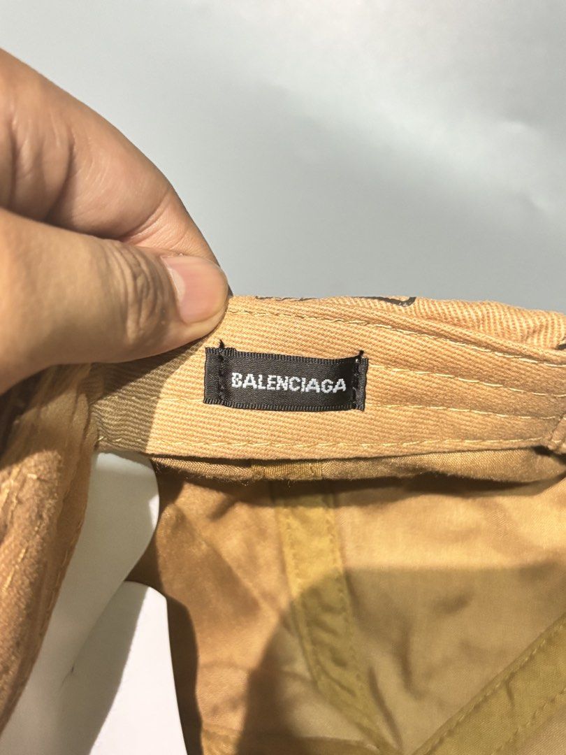 Balenciaga All Over Logo Baseball Cap (Category: Caps & Hats) located in Manila. Submitted by gilmorecapz (Listing ID 1463441594, Image 2). Description: - Authentic Balenciaga cap - All-over logo print in black on tan - Made in Italy - Size M - Adjustable strap for a perfect fit - Ideal for daily use.