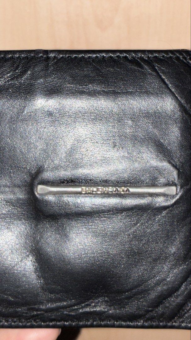 Balenciaga Black Leather Bifold Wallet (Category: Luxury Bags & Wallets) located in Placer. Submitted by talaalond61563 (Listing ID 1463339277, Image 2). Description: - Authentic Balenciaga black leather bifold wallet - Features the iconic Balenciaga Paris logo inside - Ample card slots and compartments for organization - Still has plenty of life and functionality left.