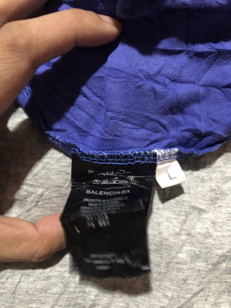 Balenciaga Logo T-Shirt (Category: Tshirts & Polo Shirts ) located in Manila. Submitted by bakithrift213 (Listing ID 1463495459, Image 3). Description: - Authentic Balenciaga T-Shirts (2 pcs) - Color: Blue with classic logo - Size: Large (L) - Origin: Made in Portugal - Condition: Great, no major flaws - Grab these iconic designer tees now!.