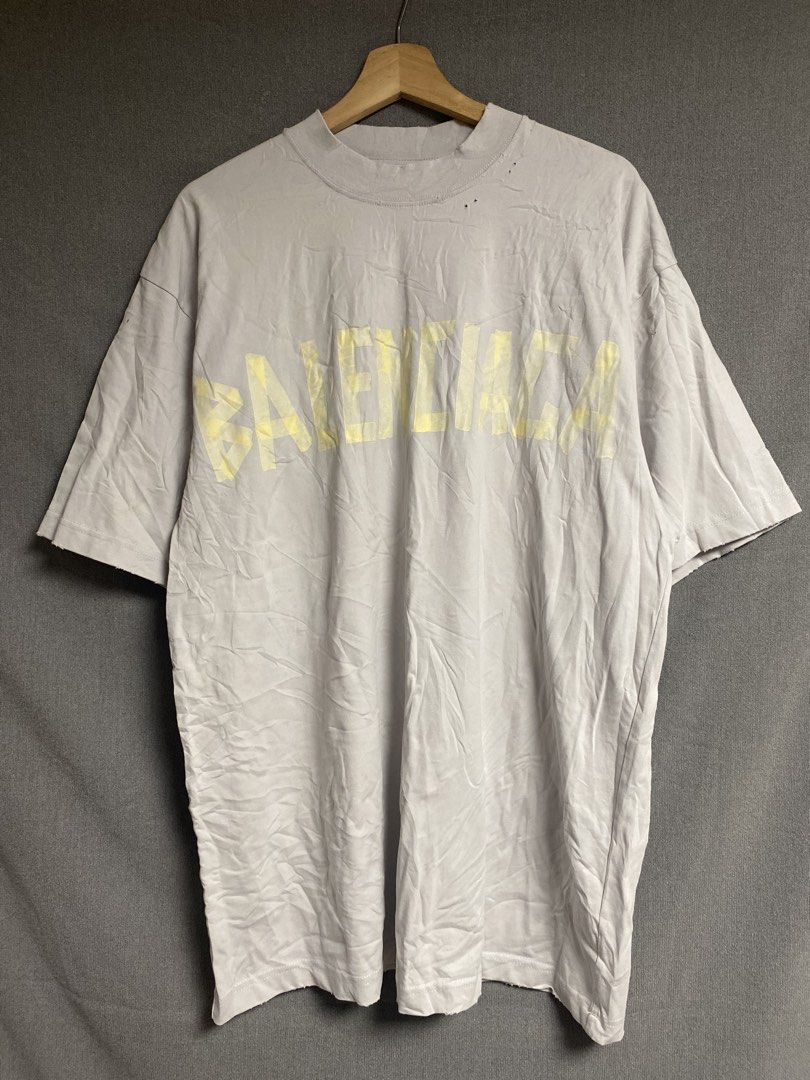 Balenciga Distressed Shirt (Category: Tshirts & Polo Shirts ) located in Cabuyao City. Submitted by ukaythriftshirt (Listing ID 1463397084, Image 1). Description: Balenciaga Distressed Shirt Excellent Condition Xlarge 23 Dimes 31.5 Color rate 9/10 Cut tags No hard issue need hard wash only - 450.