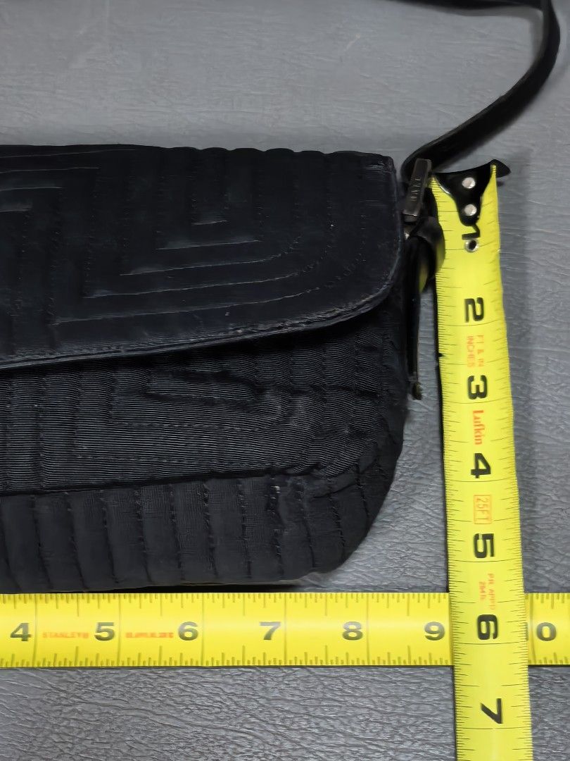 Bally Black Quilted Shoulder Bag (Category: Luxury Bags & Wallets) located in Cagayan de Oro. Submitted by pootx (Listing ID 1463484835, Image 2). Description: -please check the last photo for flaws - Authentic black Bally shoulder bag - Made in Italy - Elegant quilted pattern on the front flap - Interior zip pocket for secure storage - Adjustable strap for comfortable wear - Approximately 9 inches wide.