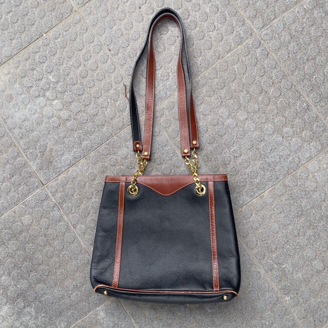 Bally Original Shoulder Bag (Category: Tote Bags) located in Manila. Submitted by xeych (Listing ID 1463399922, Image 3). Description: Vintage Bally Two-Tone Woven Leather Chain Shoulder Bag / Tote ORIGINAL Price: ₱3,700 Color: Two-Tone Black and Rich Brown Condition: Excellent ✅ Material: Gold-tone chain & emblem, Leather Bag Closure: Open top/ Magnetic snap Carry: Comfortable, Dual leather shoulder straps DM / PM for more additional photos and 