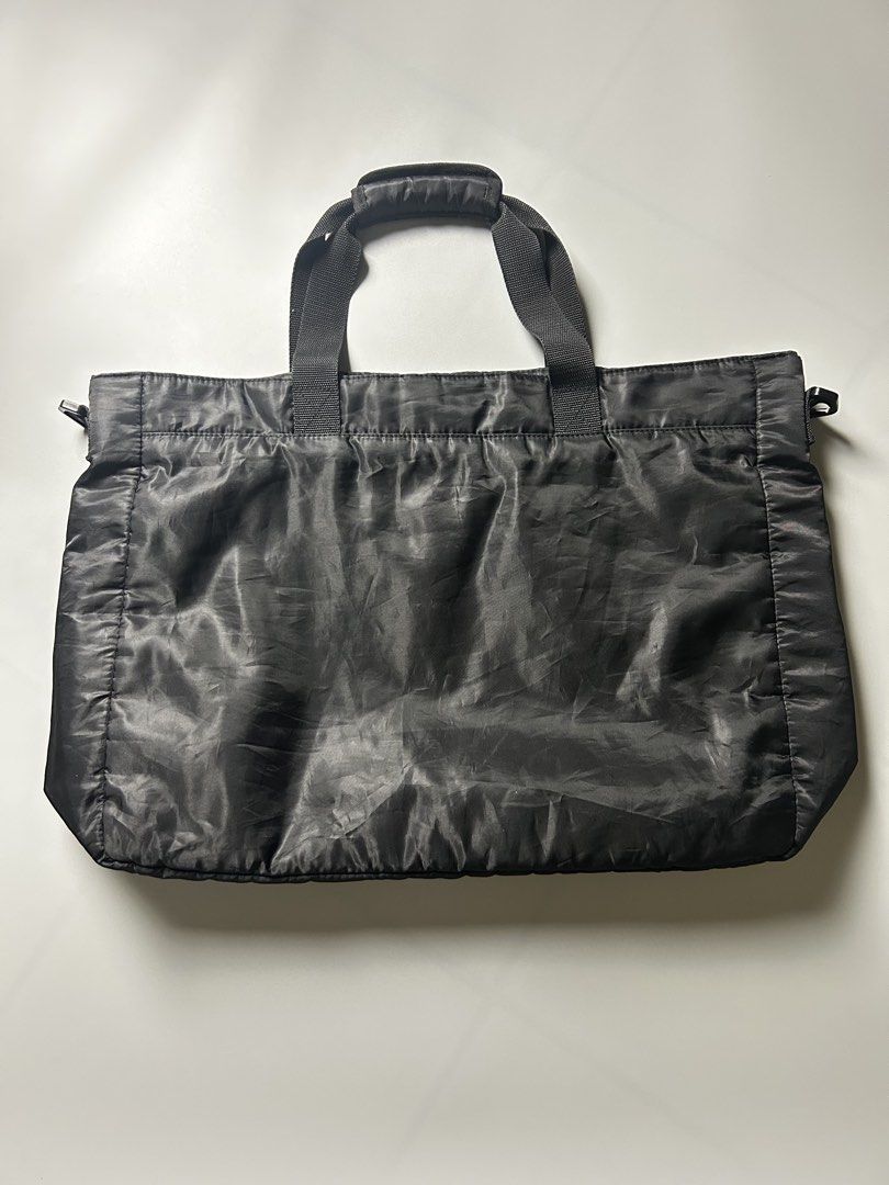 BAPE Black Tote Bag with Ape Head Logo (Category: Tote Bags) located in Tacloban City. Submitted by azthrifting24 (Listing ID 1463393428, Image 2). Description: - Authentic BAPE Black Tote Bag - Features the iconic BAPE Ape Head logo prominently on the front - Two large, convenient front pockets for quick access to essentials - Spacious main compartment offers ample storage for daily necessities or travel items - Equipped with comfortable top han